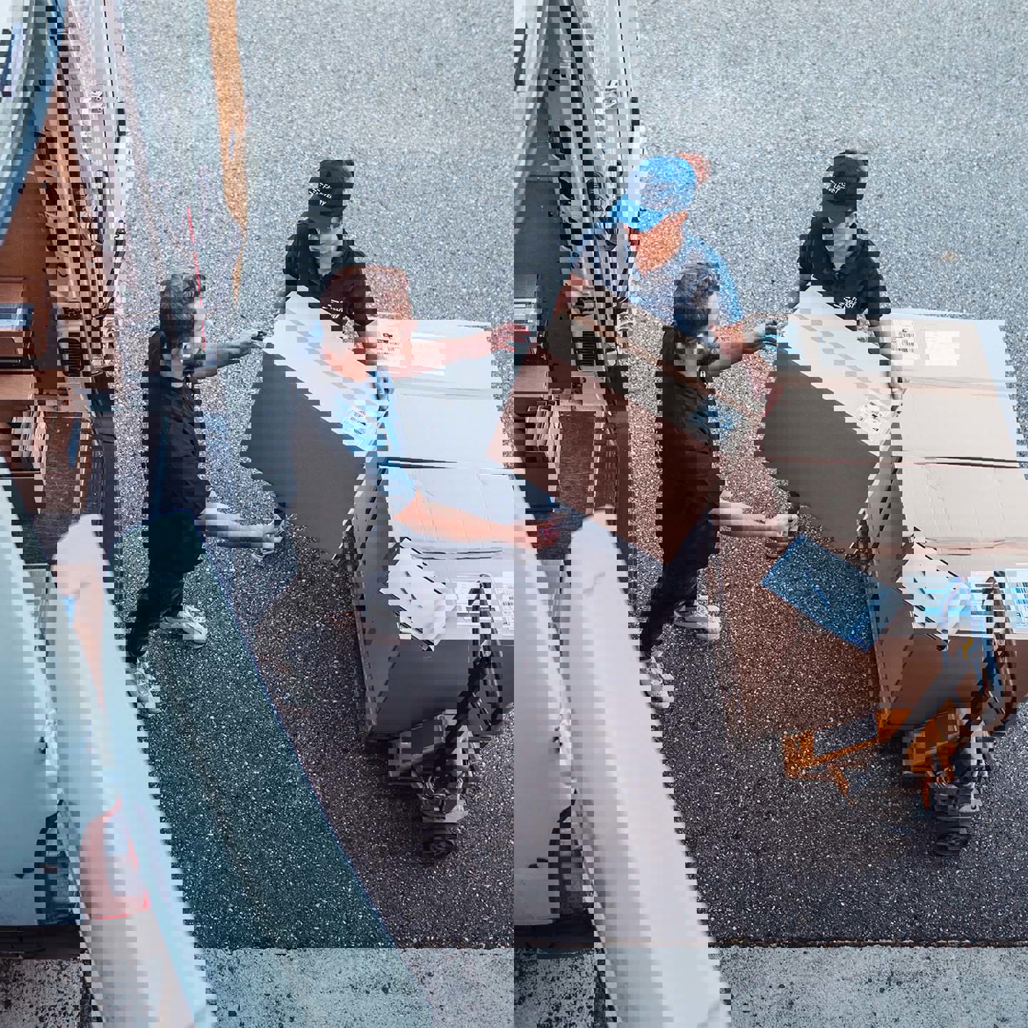 Woman handing box to man