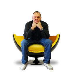 Paul Clark sat in yellow chair