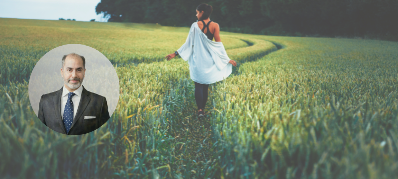 Woman walking through a field-insest iwth image of Charles Taymout